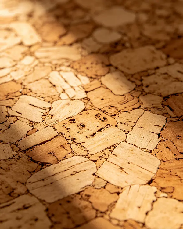 Sustainable cork material texture representing robust supply chain management and timeline accountability.