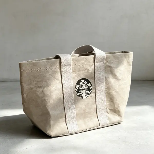 Custom wide-mouth beige washable paper tote bag with shoulder handles for corporate event giveaways.