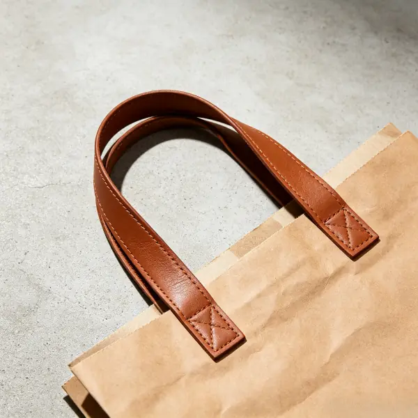 Custom washable paper gift bags with leather handles