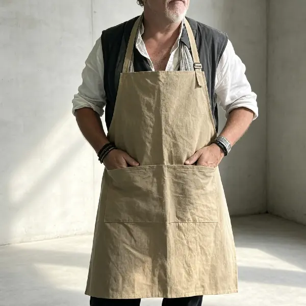Durable washable kraft paper workwear apron with front pockets for cafes, kitchens, and hospitality staff
