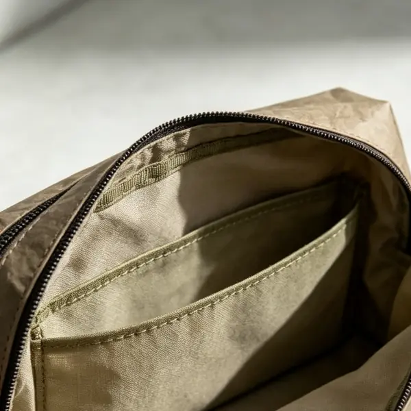 Interior view of washable kraft paper pouch featuring cotton lining and organized inner sleeve pocket
